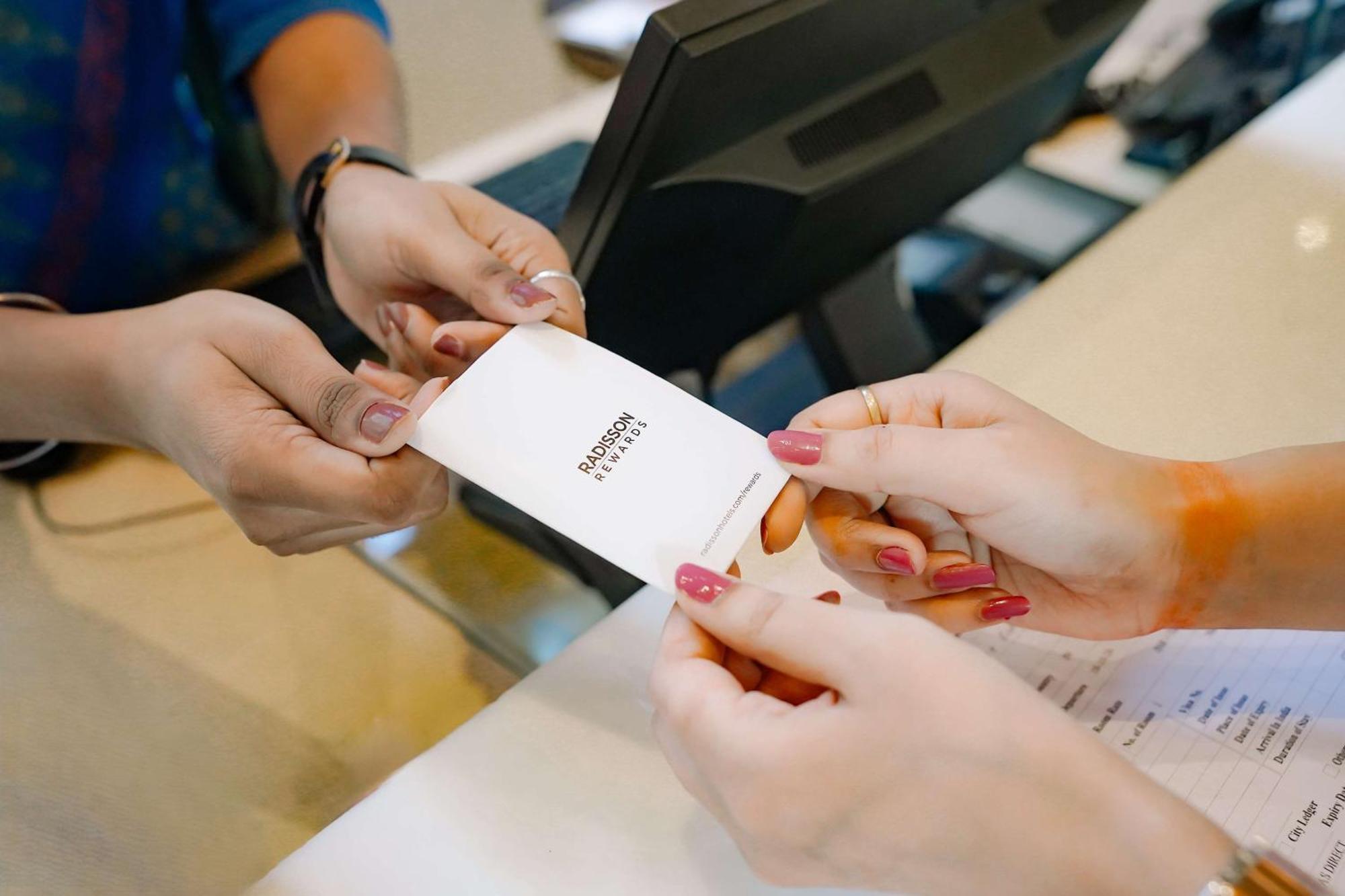 阿姆利则丽笙酒店 外观 照片 A person's identity is verified with a passport at a border crossing.